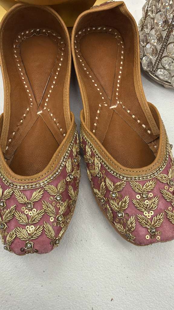 Close-up of Zoya Rose Pink Jutti showcasing detailed gold Zari embroidery on rich mauve fabric, stylish khussa shoes for women.