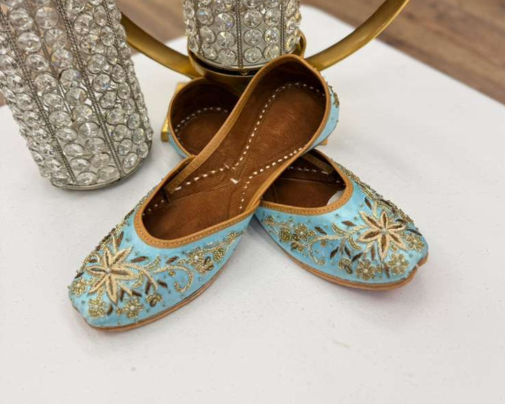 Elegant Bisma Light Blue Jutti - Blue Khussa with detailed gold threadwork, perfect ethnic footwear for festive and formal attire.