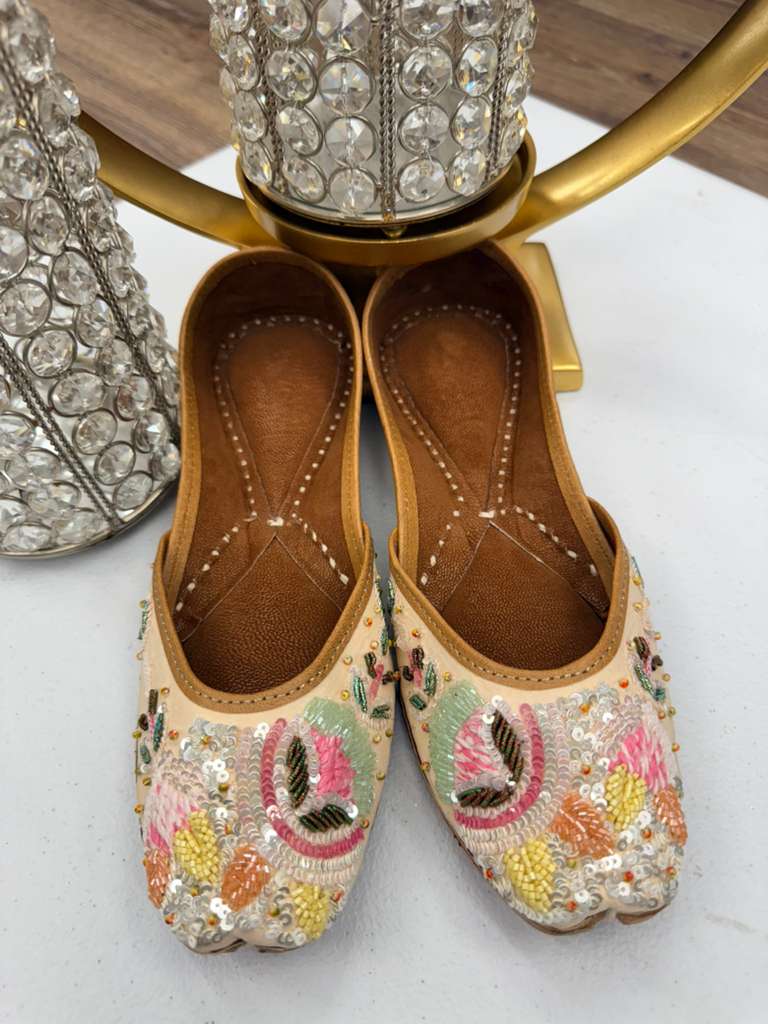 Pearl and craft-inspired Sundus Sequin Jutti with ivory base and colorful embellishments, perfect for elegant khussa mojaris lovers.