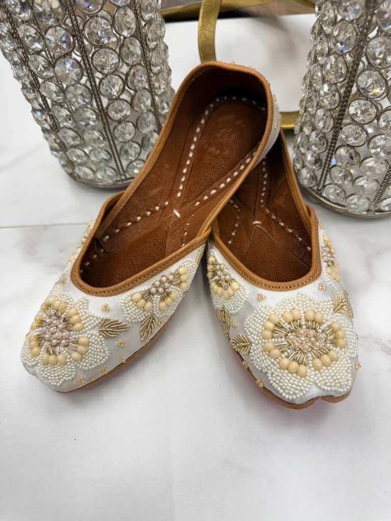 Sultana Jutti - White Khussa with intricate pearl beadwork and floral embroidery, ideal for traditional and festive wear.