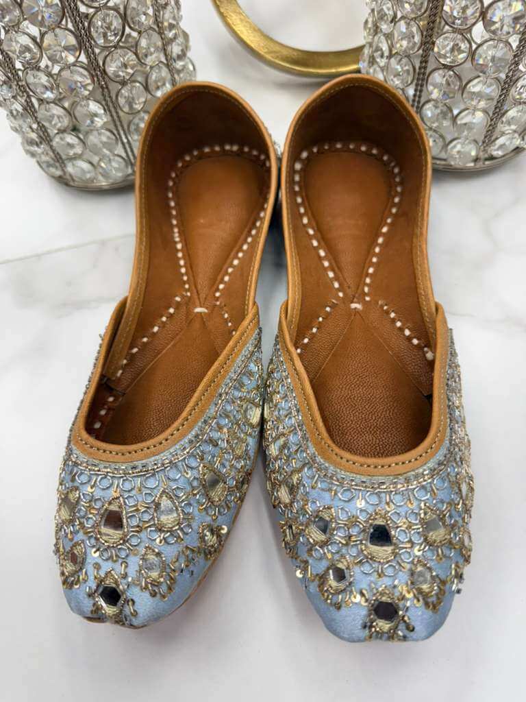 Manika Ice Blue Jutti - Blue Khussa featuring detailed hand embroidery and shimmering accents, ideal for festive and formal occasions.