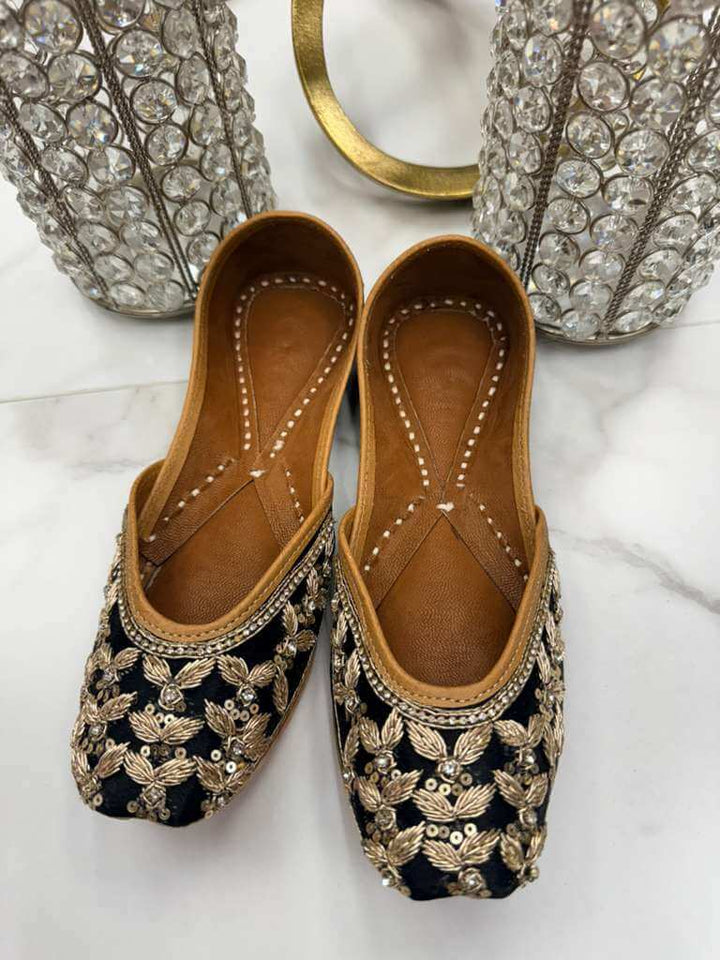 Priyanka Black Jutti - Woman Shoe | Timeless Elegance with handcrafted gold embellishments, blending luxury and comfort in flat footwear.