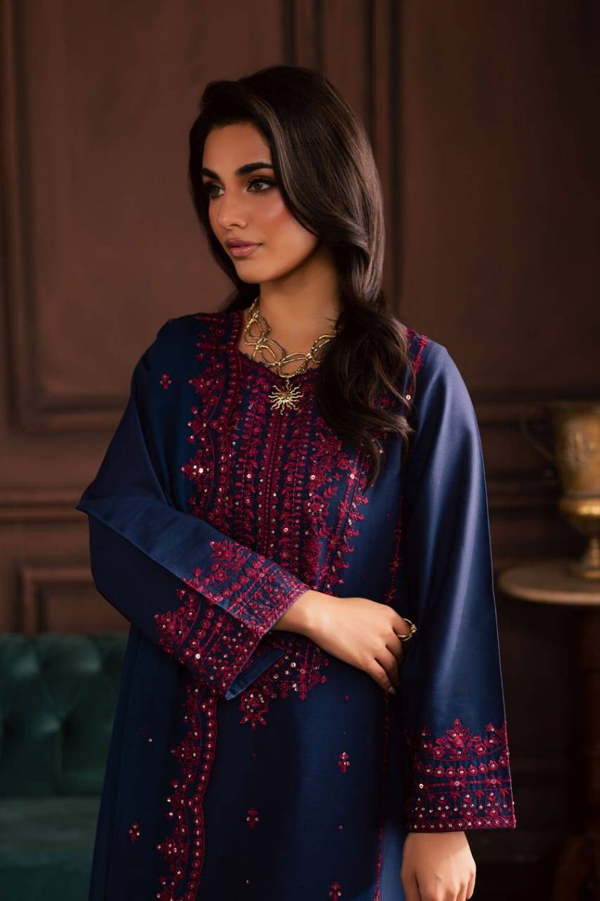 Close-up of BATIK Lamia 3Pc navy khaddar shirt showcasing detailed pink embroidery on neckline and sleeves, perfect for elegant winter gatherings.