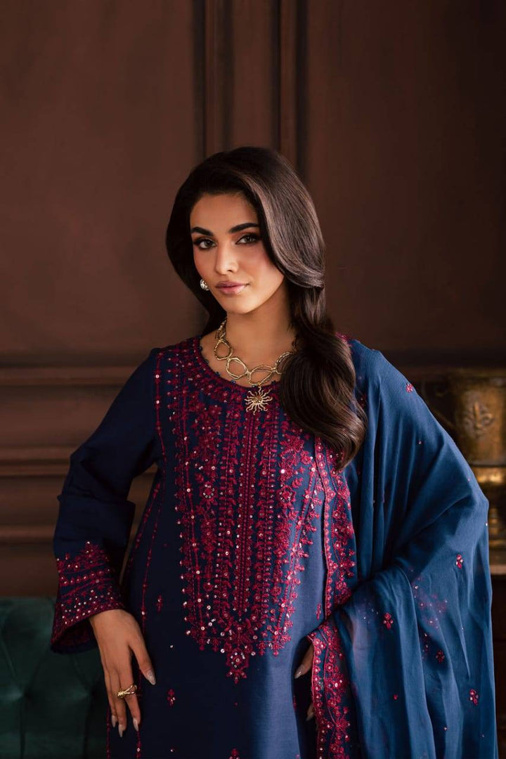 Front view of BATIK Lamia 3Pc embroidered khaddar dress with pink detailing, showcasing neckline and sleeve embellishments for winter fashion.