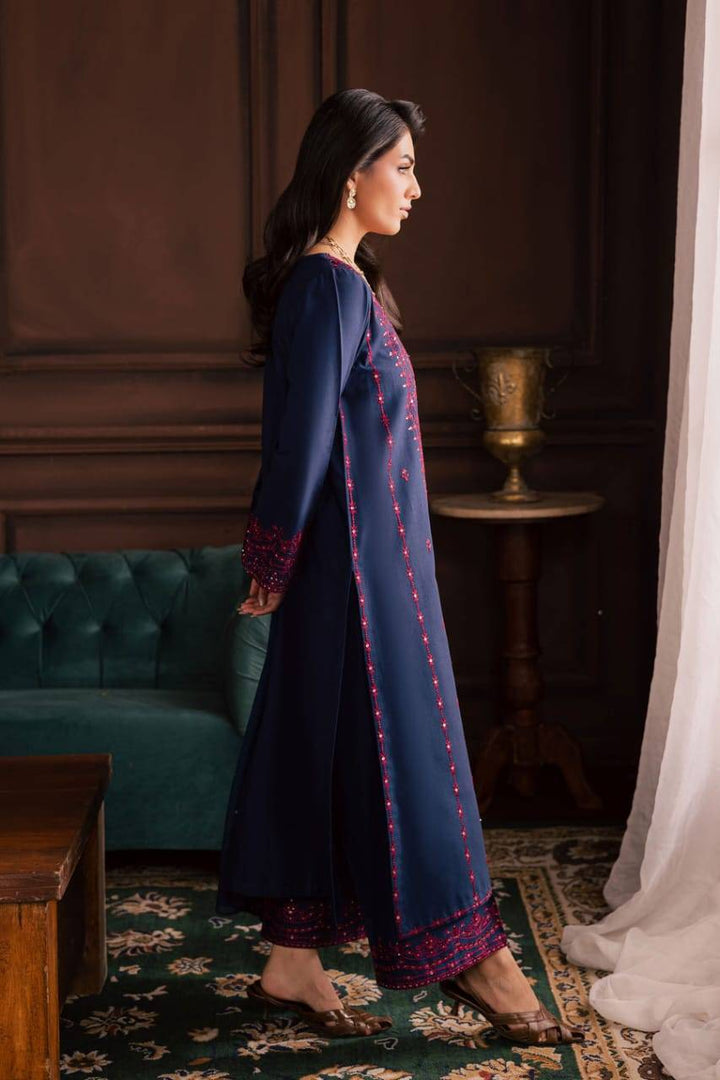 Side view of BATIK Lamia 3Pc khaddar dress showing embroidery along the side seam and cuffs, styled for winter elegance.