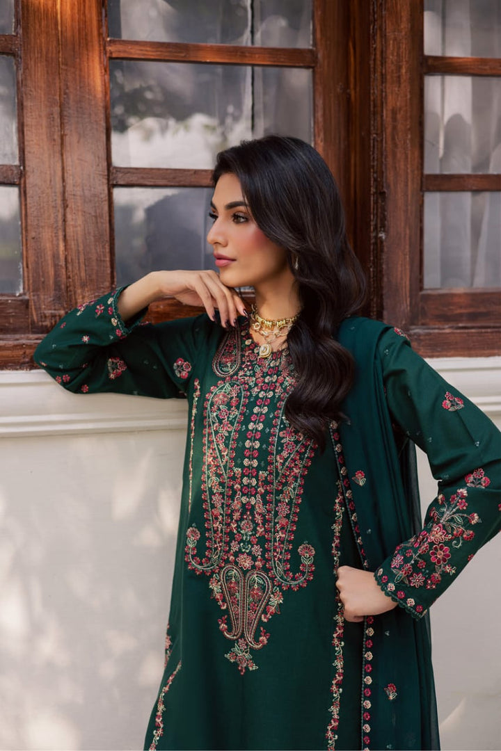 Side pose of model in BATIK Rain 3Pc embroidered khaddar dress, emphasizing sleeve and front panel embroidery with matching dupatta.