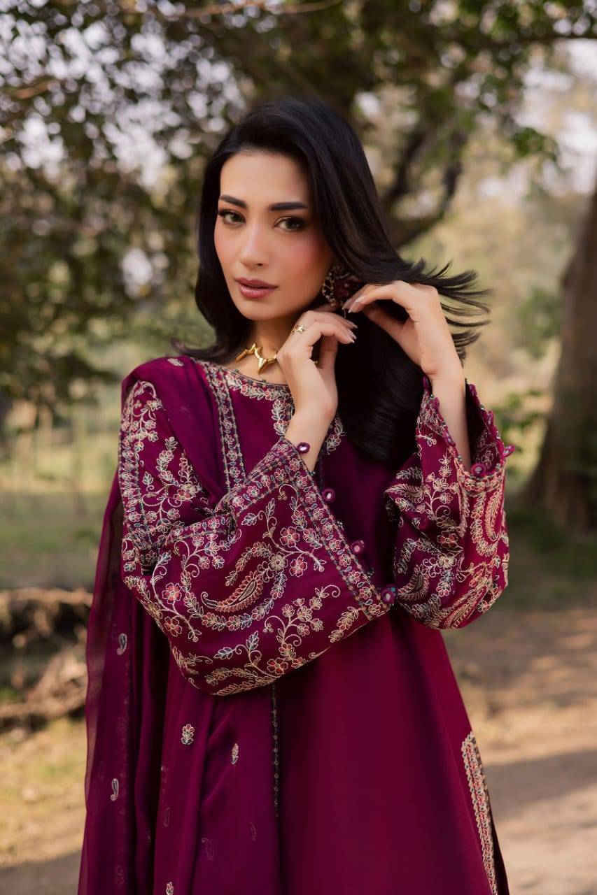 Ready to wear BATIK Sheharbano 3Pc dress in maroon khaddar with embroidered shirt, trousers, and dupatta, styled for seasonal celebrations.