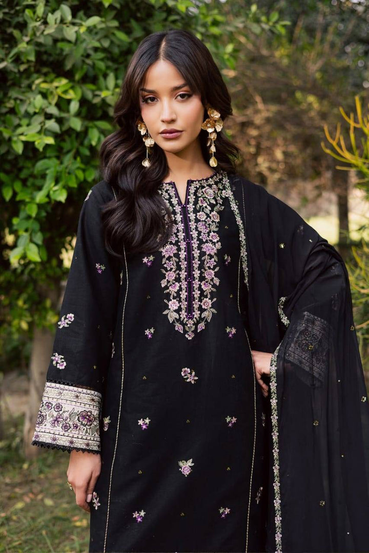 Detailed view of PAKISTANI BATIK WOMEN DRESS with floral embroidery on neckline and sleeves, paired with a sheer sequined dupatta.