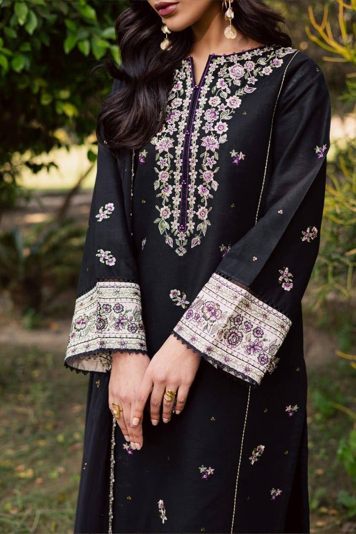 Close-up of embroidered sleeve and neckline details on BATIK Night Bloom khaddar dress, showcasing craftsmanship in Pakistani women's clothing.
