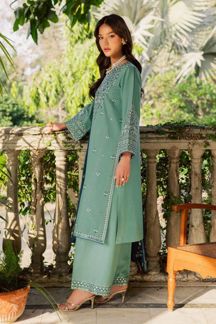 Side view of BATIK Gridle 3Pc ready-to-wear embroidered khaddar dress in green with intricate sleeve detailing and matching culottes.