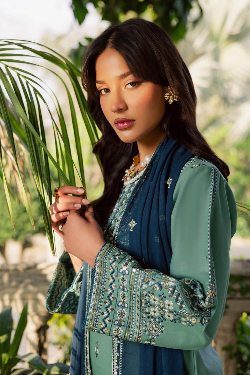 Close-up of BATIK Gridle 3Pc dress highlighting embroidered neckline and sleeve design, styled with navy dupatta for elegant occasions.