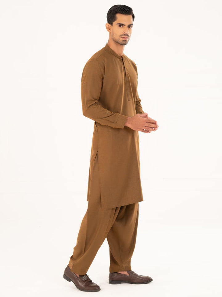 Side view of ALMIRAH 2-piece brown kameez shalwar for men, featuring tailored fit and winter-appropriate fabric.