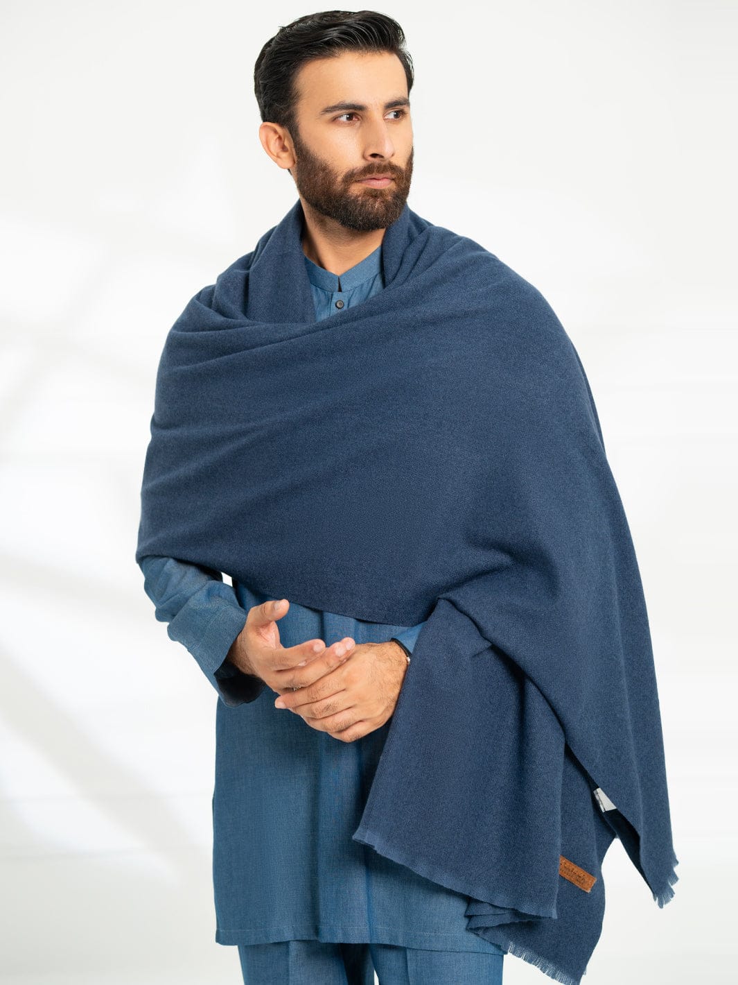 ALMIRAH Royal Blue Casual Shawl draped over shoulders, showcasing its soft texture and elegant winter wear appeal for men.