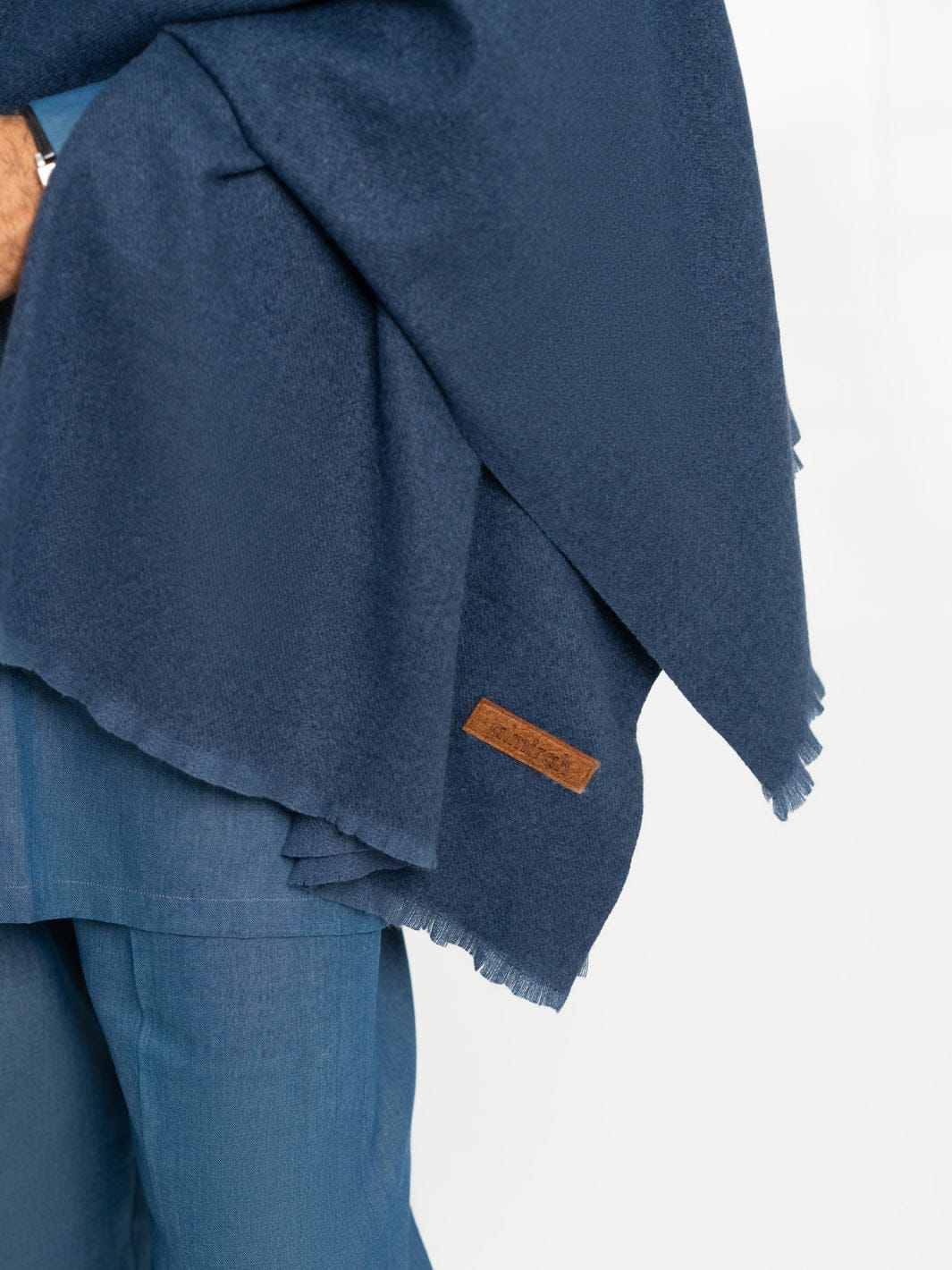 Close-up of ALMIRAH Royal Blue Casual Shawl with visible brown logo tag, highlighting premium fabric and fine edges.