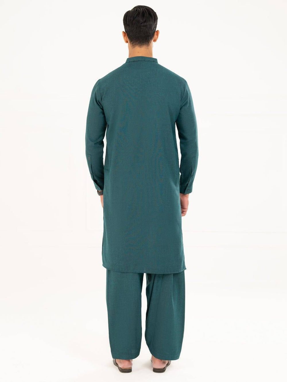 Back view of ALMIRAH men’s green kameez shalwar, showcasing full-length design and relaxed fit in blended winter fabric.