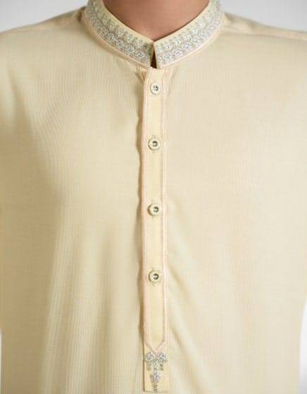 Close-up of J. Beige Blended Kameez with embroidered collar and button placket, showcasing fine detailing for boys' festive attire.