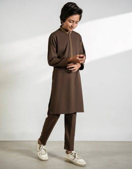 J. FEROZI KAMEEZ SHALWAR for kids in brown with modern fit, featuring embroidered neckline. Ideal Pakistani outfit for festive and casual wear.