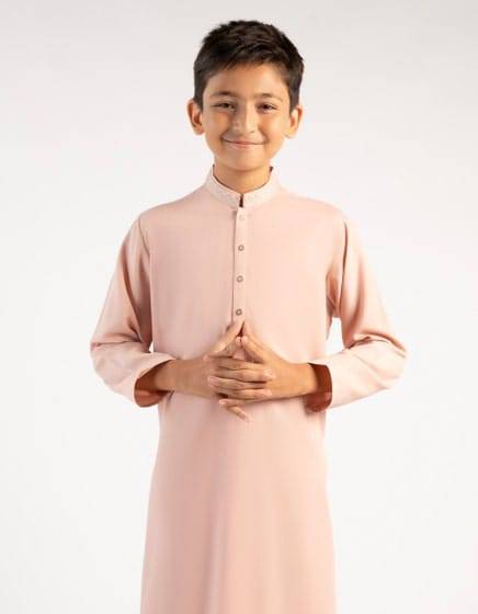 Junaid Jamshed boys pink kurta with modern fit and buttoned placket, ideal for festive occasions and everyday elegance.