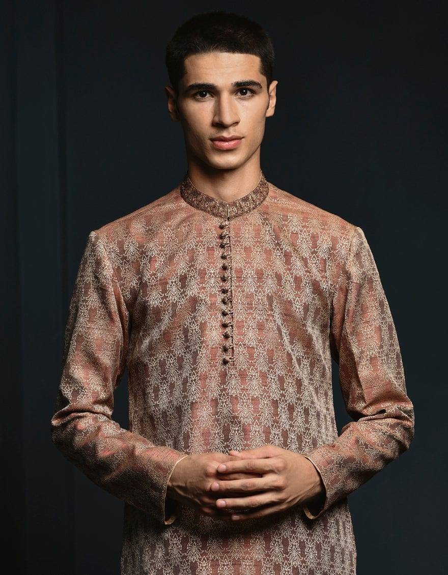 Close-up of J. ROSE GOLD Pakistani Boys Kurta USA showing detailed embroidery and button accents on rose gold fabric. Perfect for special occasions.