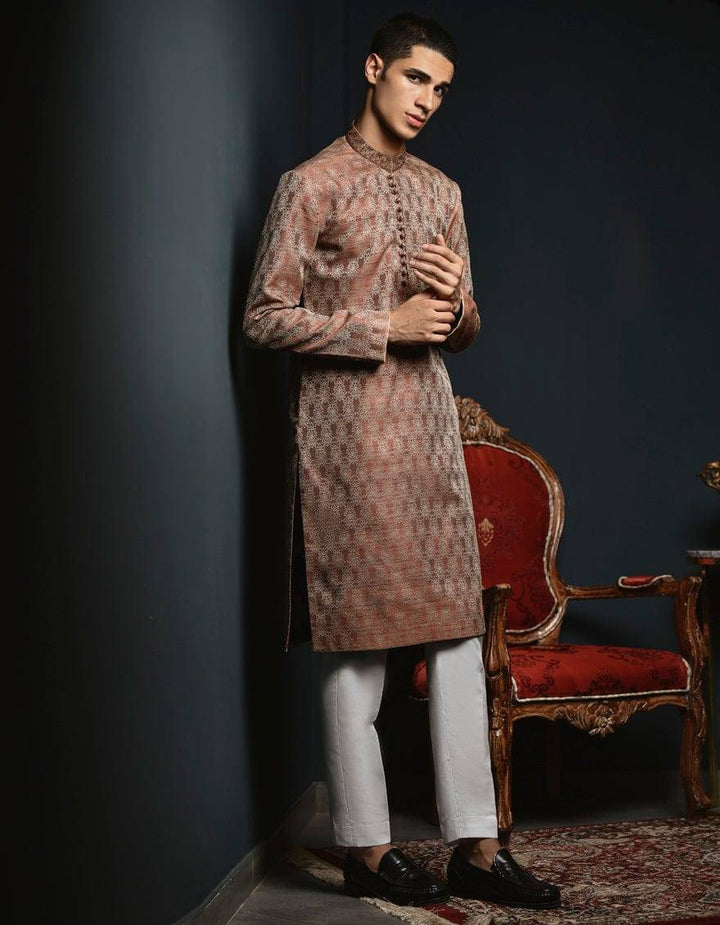 New arrival J. ROSE GOLD Pakistani Boys Kurta USA featuring elegant rose gold fabric and traditional design, styled with white trousers.