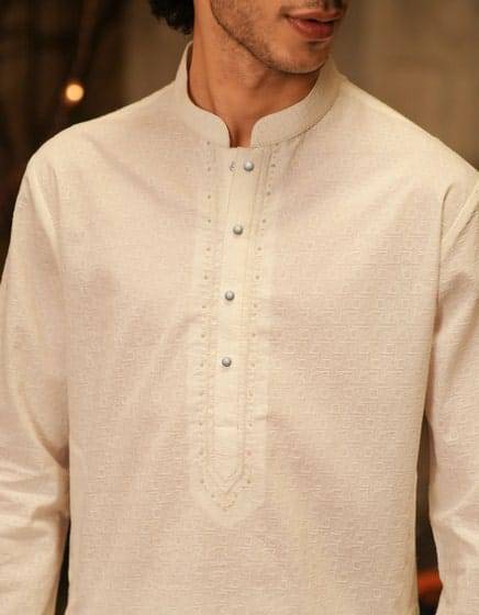 J. WHITE COTTON FORMAL KURTA - Buy J. Kurta Online | Cotton, Regular; detailed view of textured white cotton kurta with decorative buttons.