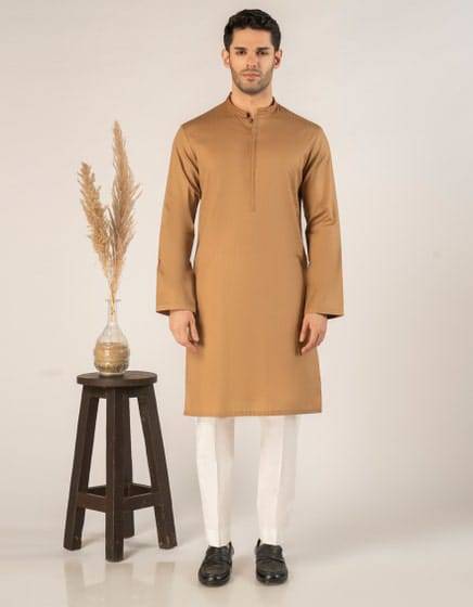 J. SEMI-FORMAL KURTA - Buy Junaid Jamshed Kurta in USA | Regular Fit beige cotton kurta for men, styled with white trousers, ideal for festive wear.