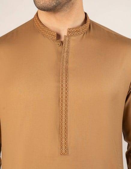 J. SEMI-FORMAL KURTA - Buy Junaid Jamshed Kurta in USA | Regular Fit detailed view of embroidered neckline and placket on beige semi-formal kurta for men.