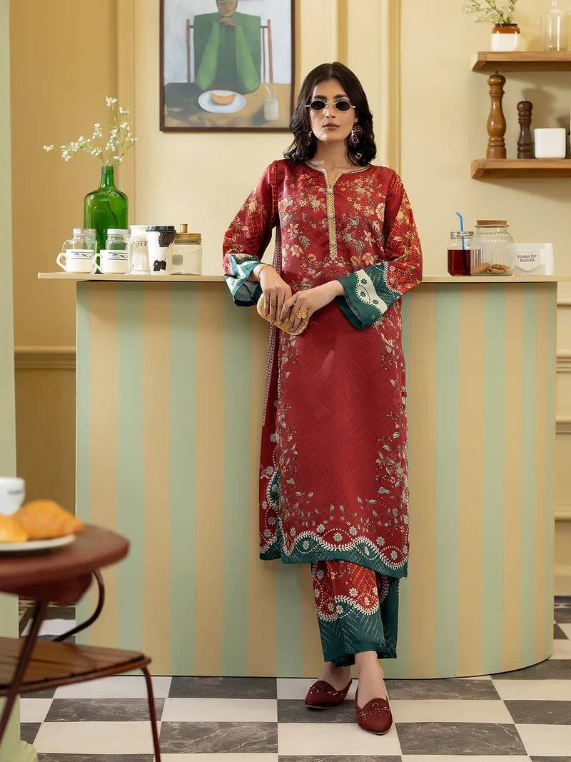 Rangreza women silk 2 piece outfit with embroidered top and printed trousers in a stylish indoor setting