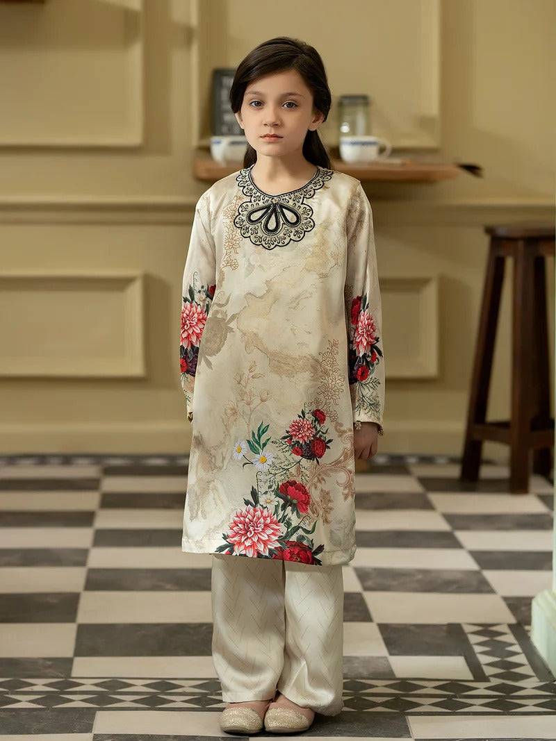 Girl wearing silk kurta with floral embroidery and matching trousers