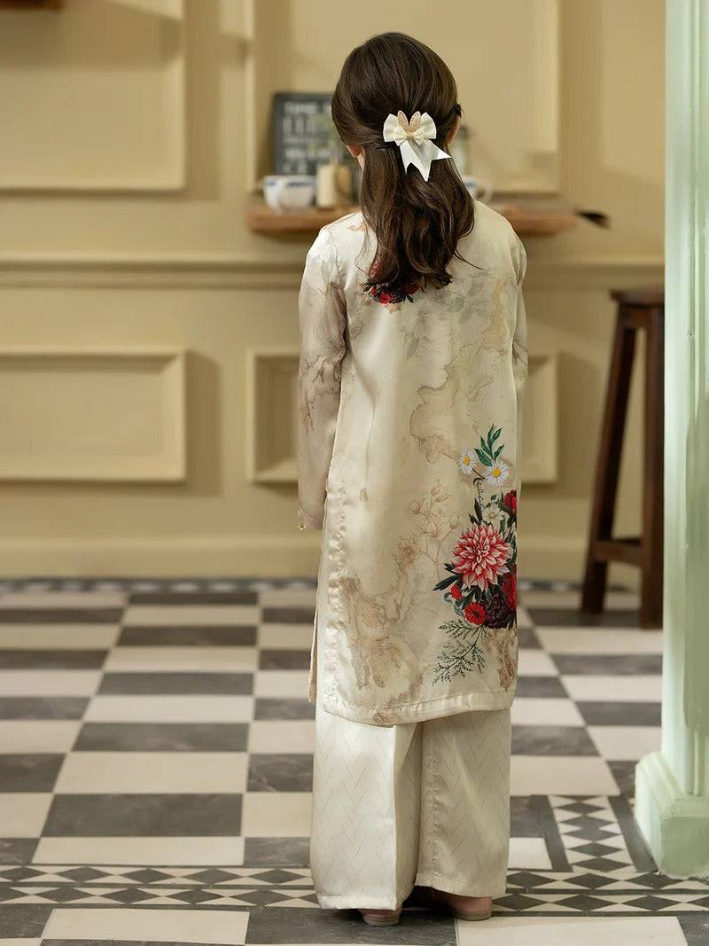 Back view of girl in silk kurta with floral embroidery and hair bow