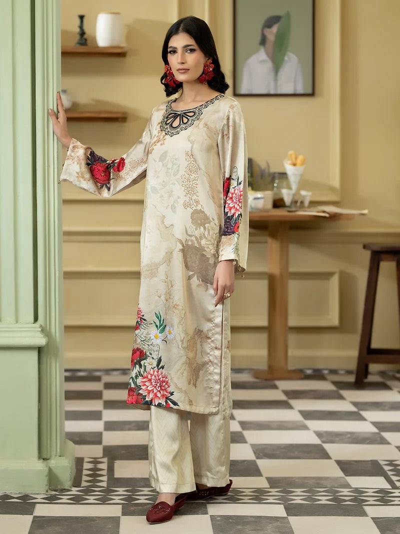 Women wearing Rangreza silk 2-piece outfit with floral embroidery and black neckline detail