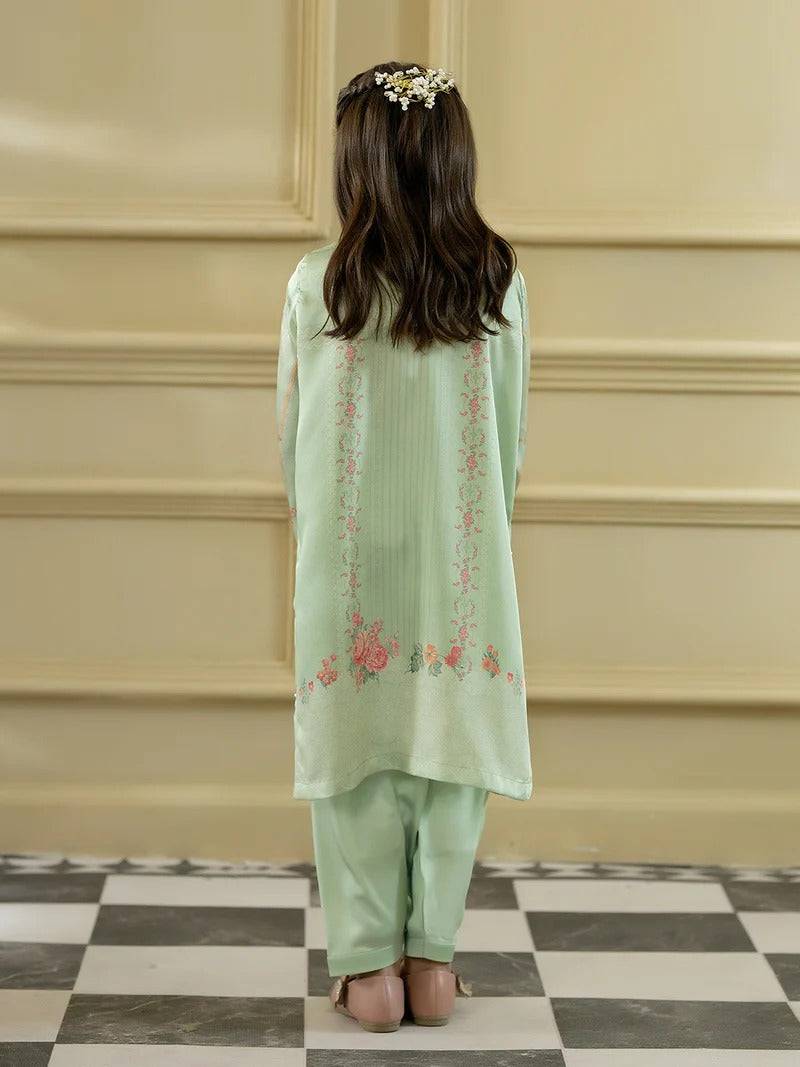 Back view of girl in green silk kurta with floral embroidery and matching trousers, traditional girl’s clothing