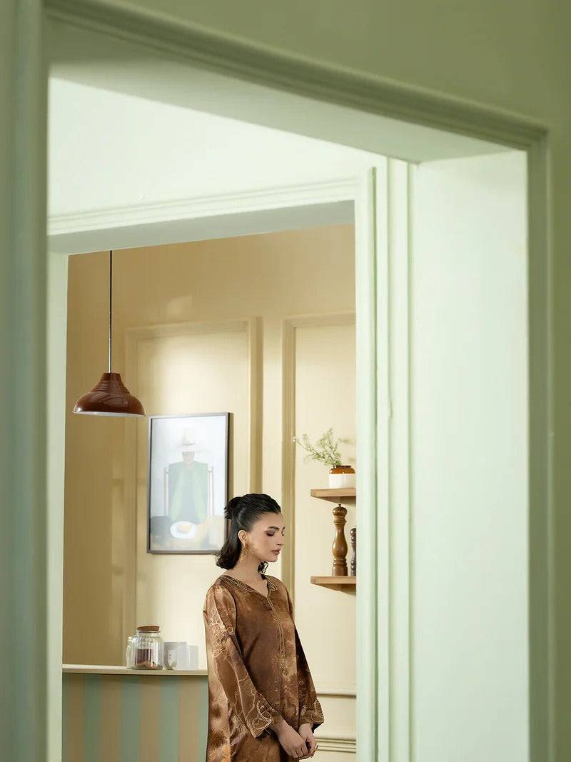 Women silk kurta with traditional design seen through door
