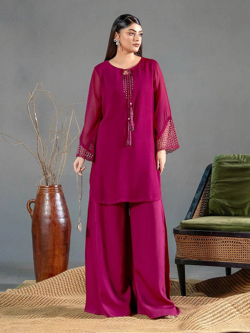 Side view of magenta chiffon kurta with embroidered sleeves and wide-leg trousers, styled for casual wear