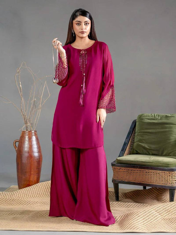 Front view of magenta chiffon kurta with embroidered sleeves and matching palazzo for women