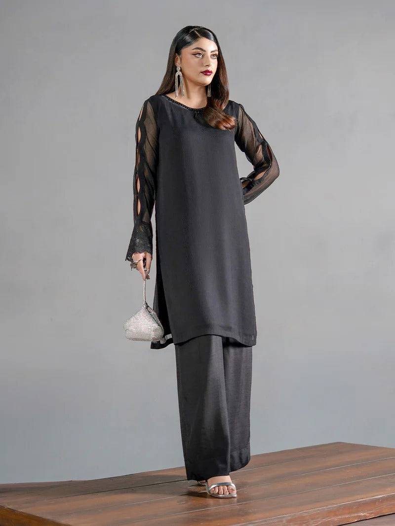 Elegant black chiffon kurta with sheer cutout sleeves and matching trousers