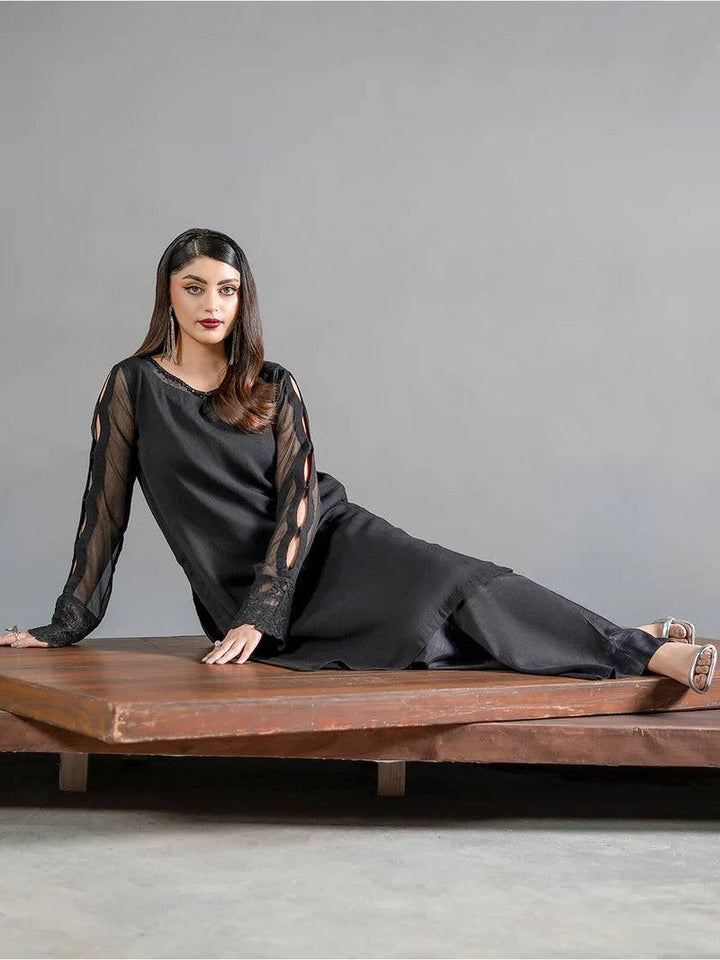 Stylish black chiffon kurta with sheer sleeve cutouts and matching trousers