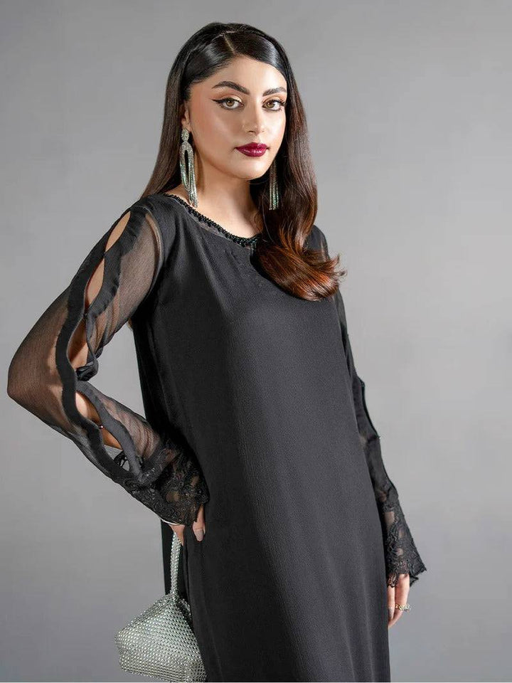 Black chiffon kurta with sheer cut-out sleeves and lace cuffs, paired with matching bottom, stylish ethnic wear for women