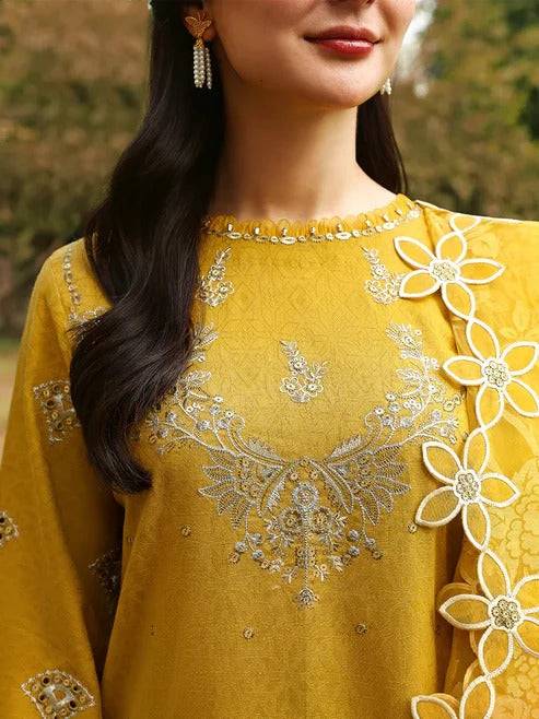 Yellow embroidered shirt with floral embellishments and intricate silver embroidery