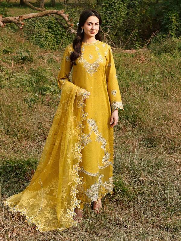 Close-up of yellow kurta with intricate embroidery and floral appliqué
