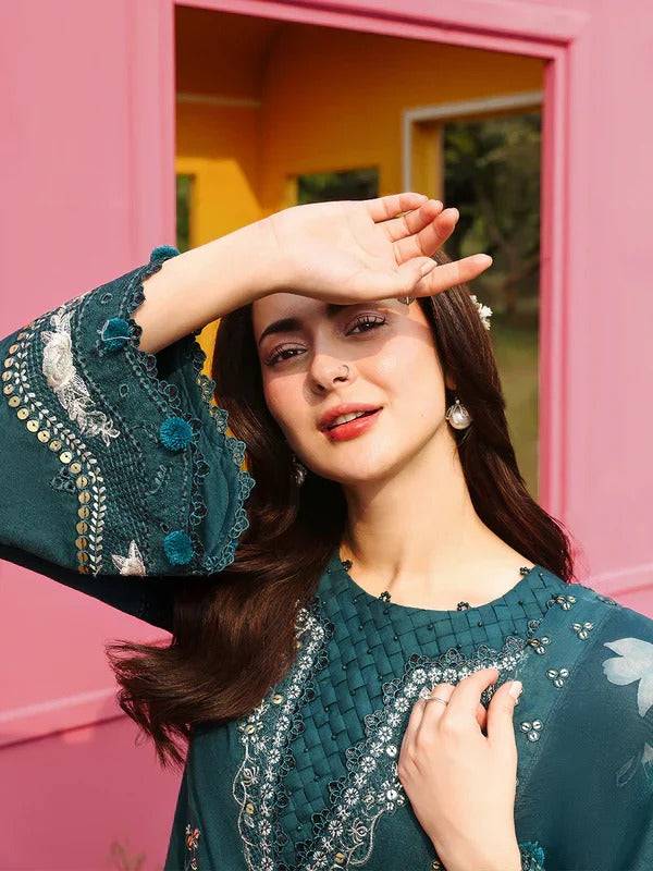 Close-up of model in teal embroidered kurta with floral dupatta