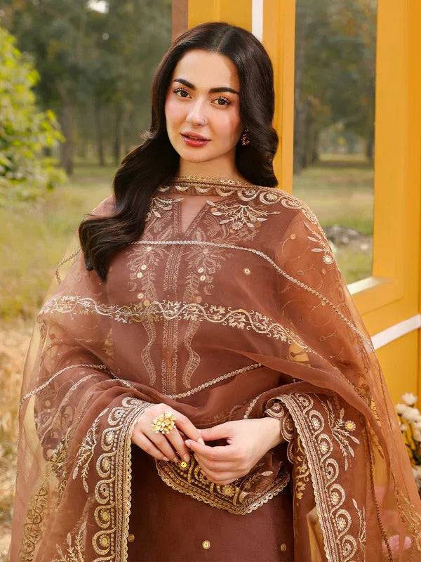 Close-up of woman in RANGREZA JANAN CINNAMON embroidered sharara suit with jewelry