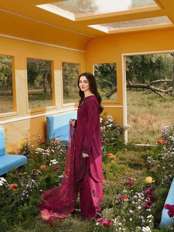Side view of maroon embroidered kurta with dupatta and palazzo, indoor setting