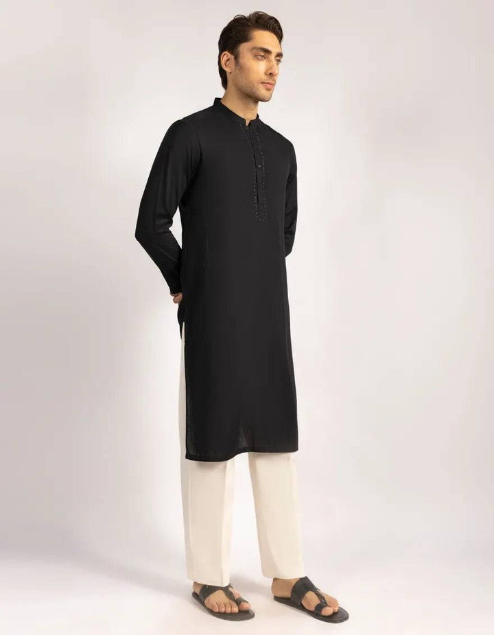 Black blended semi-formal kurta with detailed stitching and smart button styling, worn with cream trousers and sandals