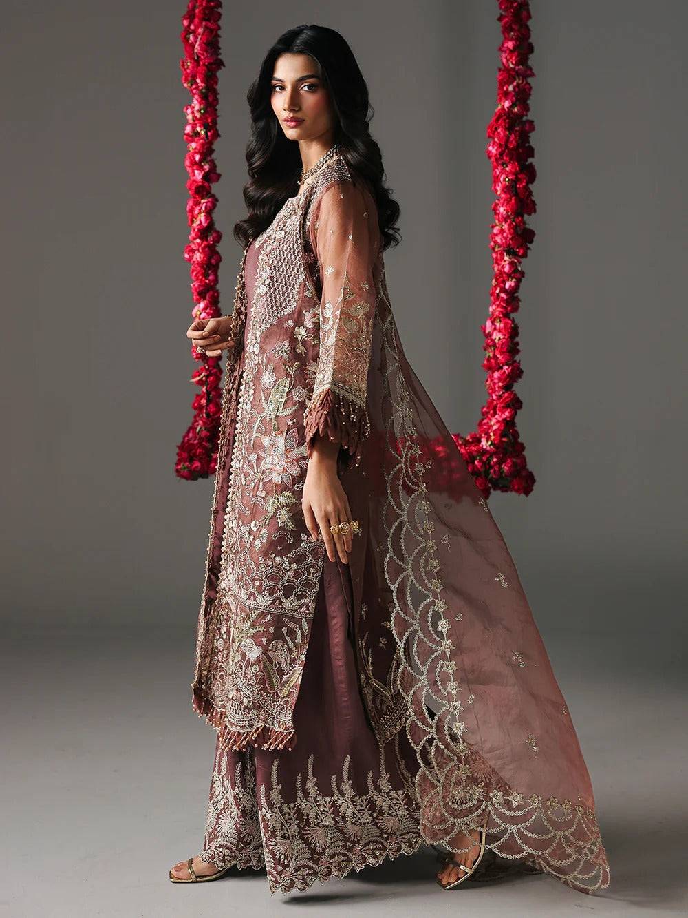 Model wearing maroon embroidered sharara with detailed embroidery for party wear