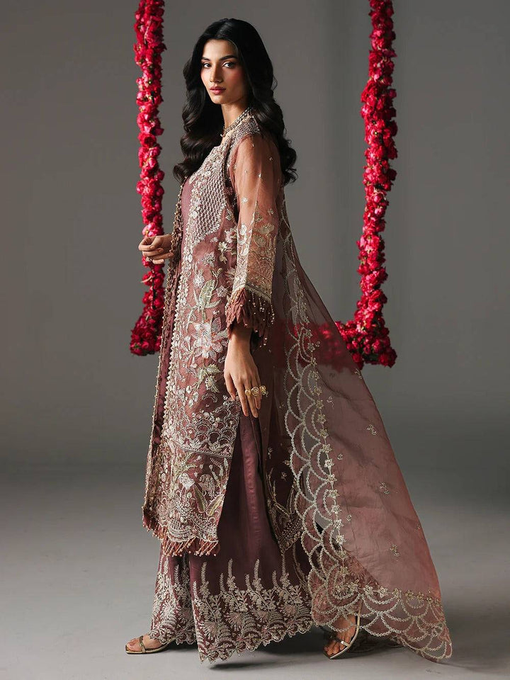 Model wearing maroon embroidered sharara with detailed embroidery for party wear