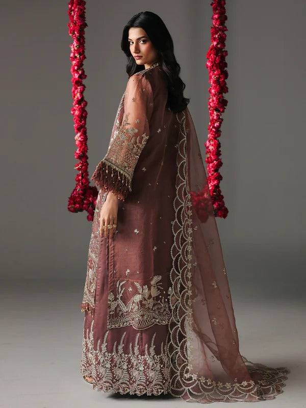 Back view of maroon embroidered sharara with intricate embroidery and sheer dupatta