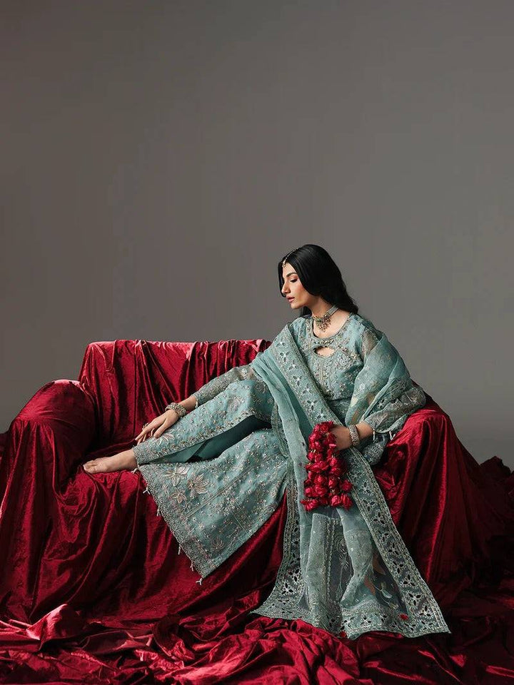 Side view of frost blue embroidered dress with dupatta