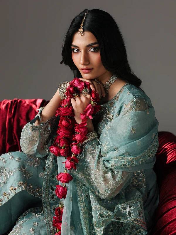 Festive blue embroidered kurta with jewelry and floral dupatta