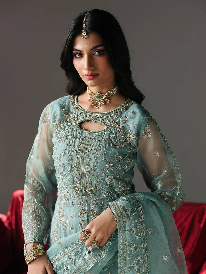 Elegant blue embroidered dress with jewelry and floral dupatta